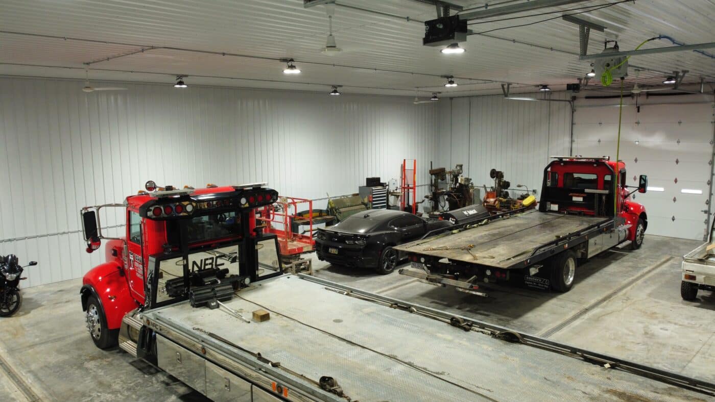 Vehicles being stored in a 100x120 commercial pole barn
