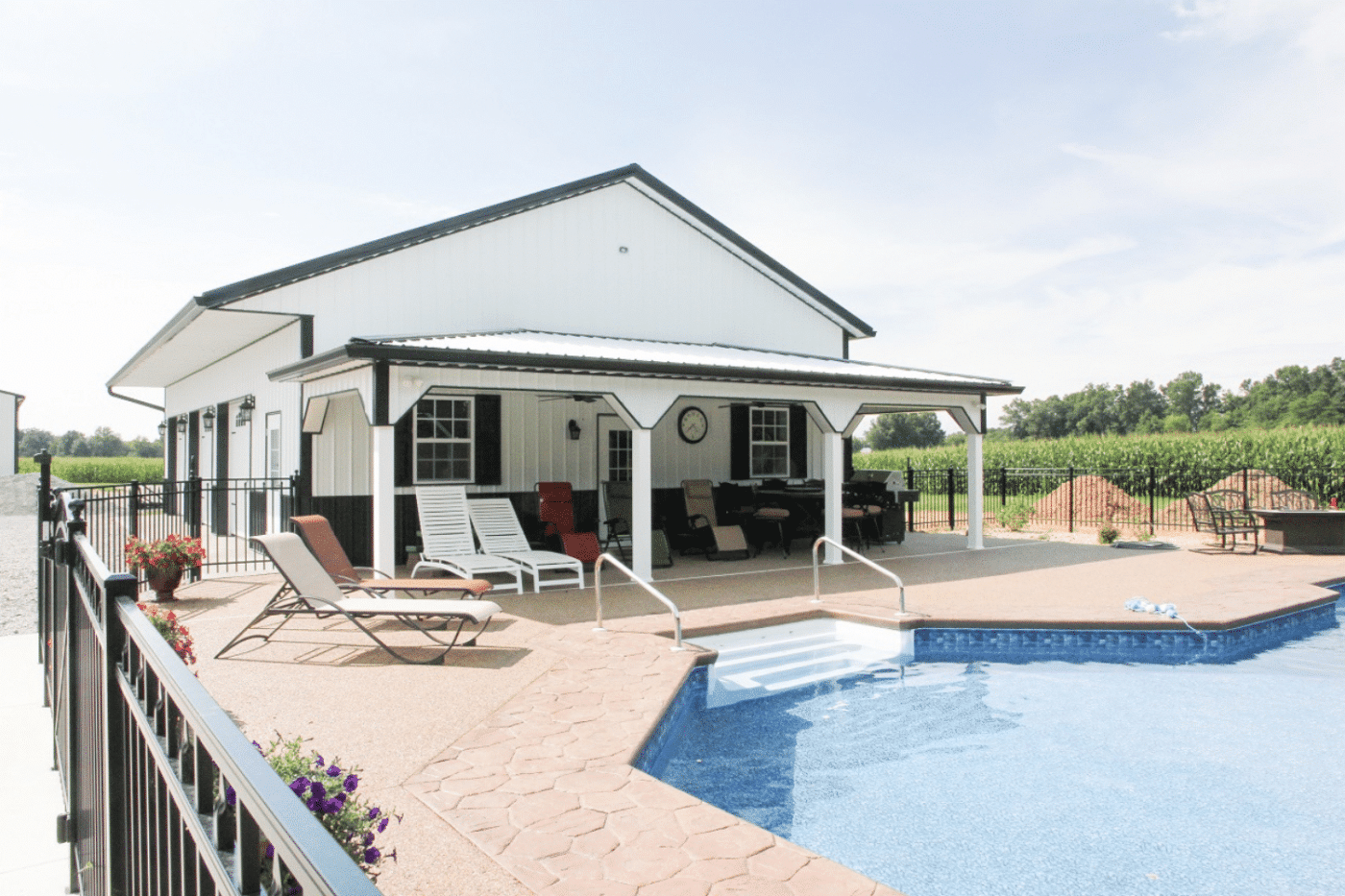 white 20x50 barndominium kit near pool