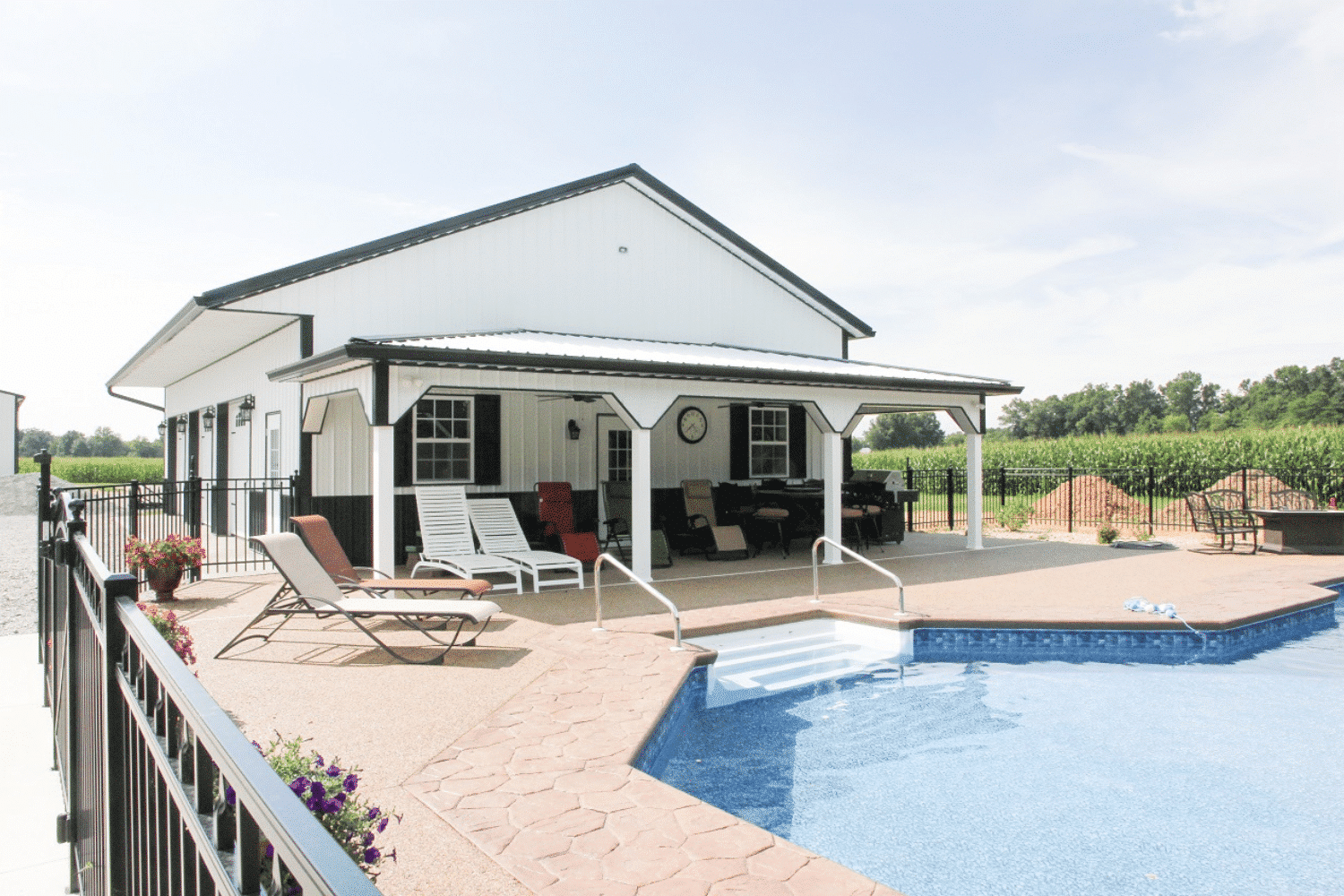 white 40x40 barndominium kit near pool