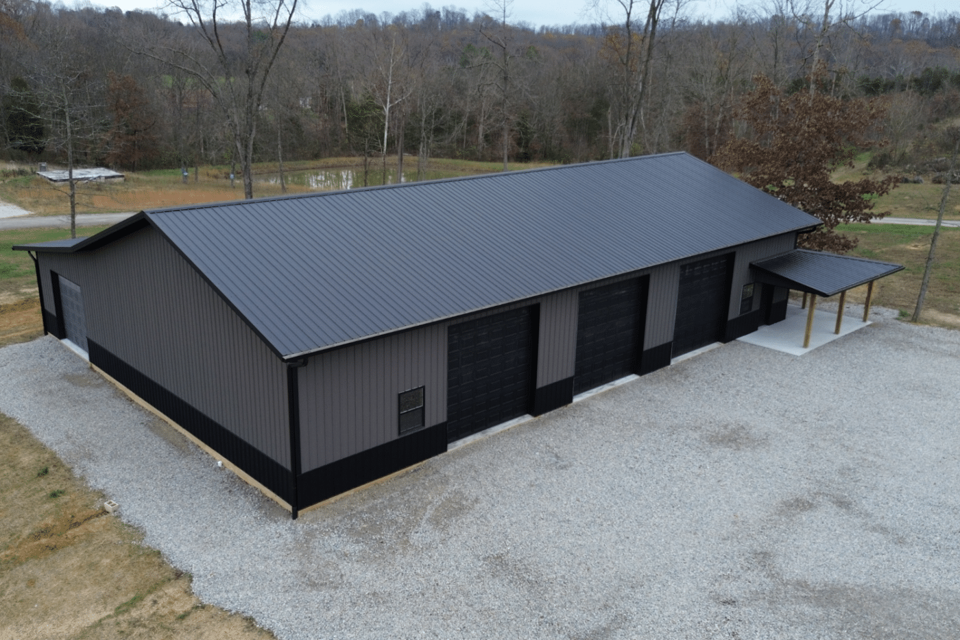 40x80 garage pole barn kit with four black garages in west union ohio