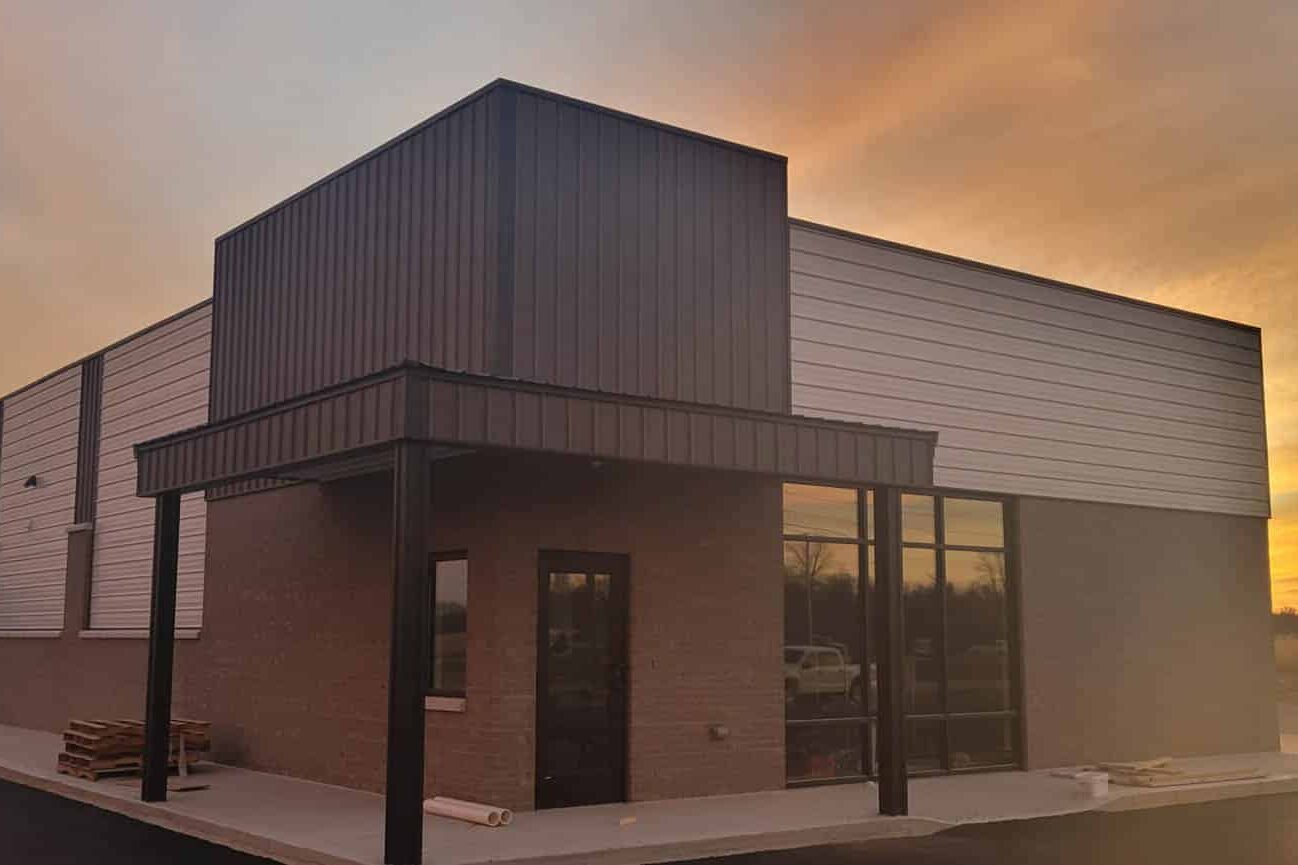 50x60 commercial pole barn at sunset