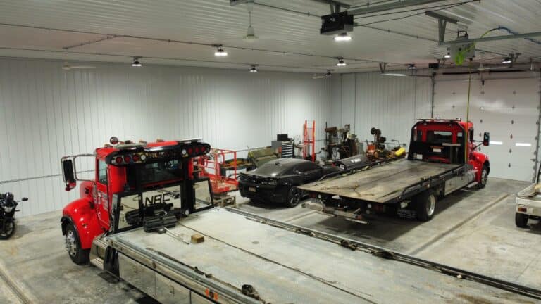 Vehicles being stored in a 60x100 commercial pole barn