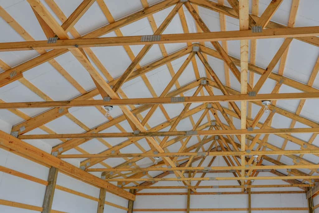 wooden roof trusses on top of a 20x30 agricultural pole barn