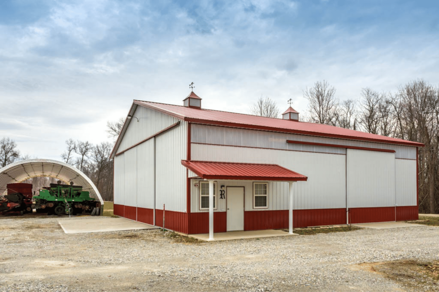 80x120 red and white equestrian pole barn kit with door