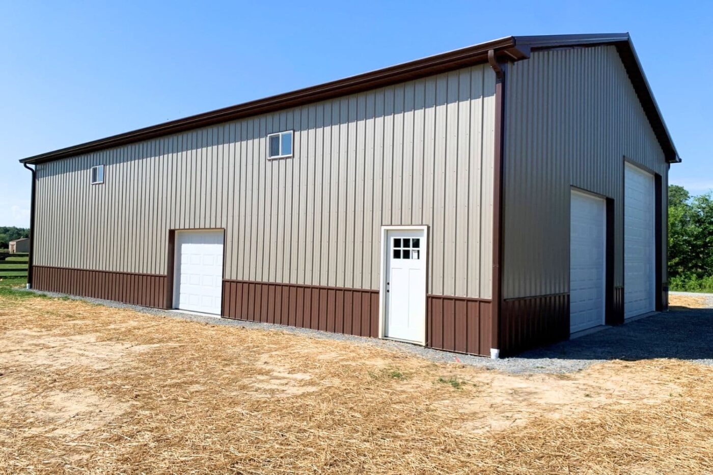 an 80x90 beige and brown pole barn garage for sale