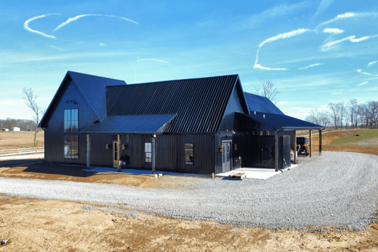 black 90x120 barndominium with tall windows and porches