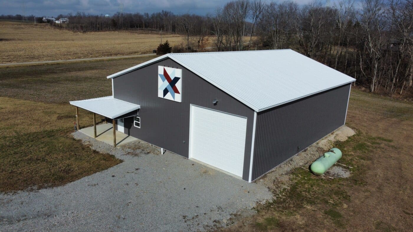 grey and white commercial pole barn kit with pavilion in Richmond IN