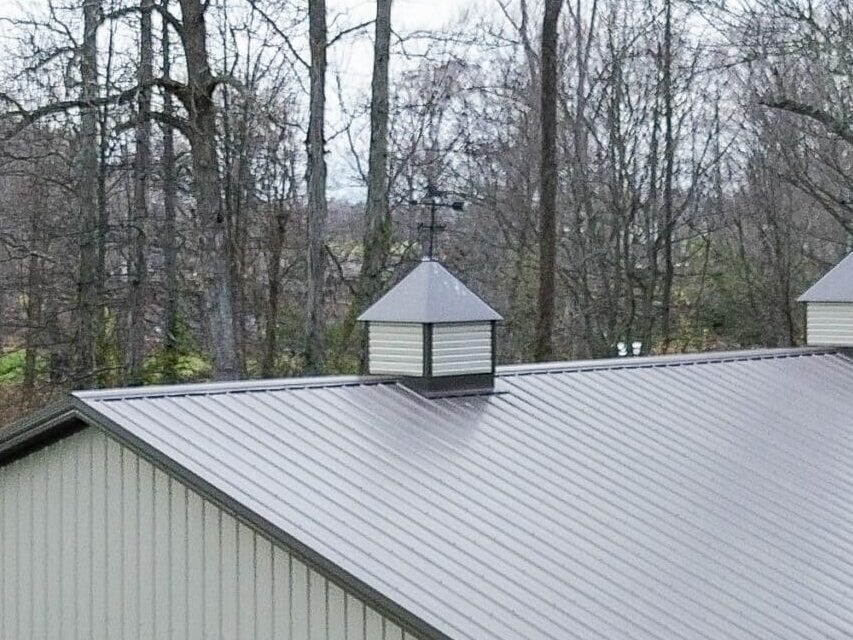 beige and brown 80x90 garage pole barn kit with one white garage and lean to porch