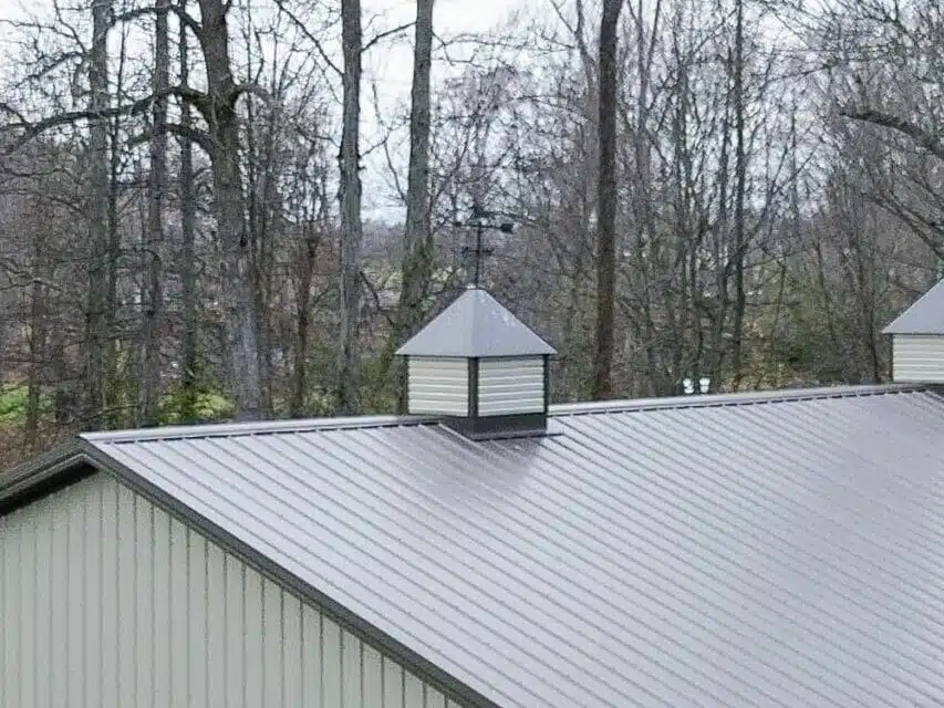 beige and brown 80x90 garage pole barn kit with one white garage and lean to porch