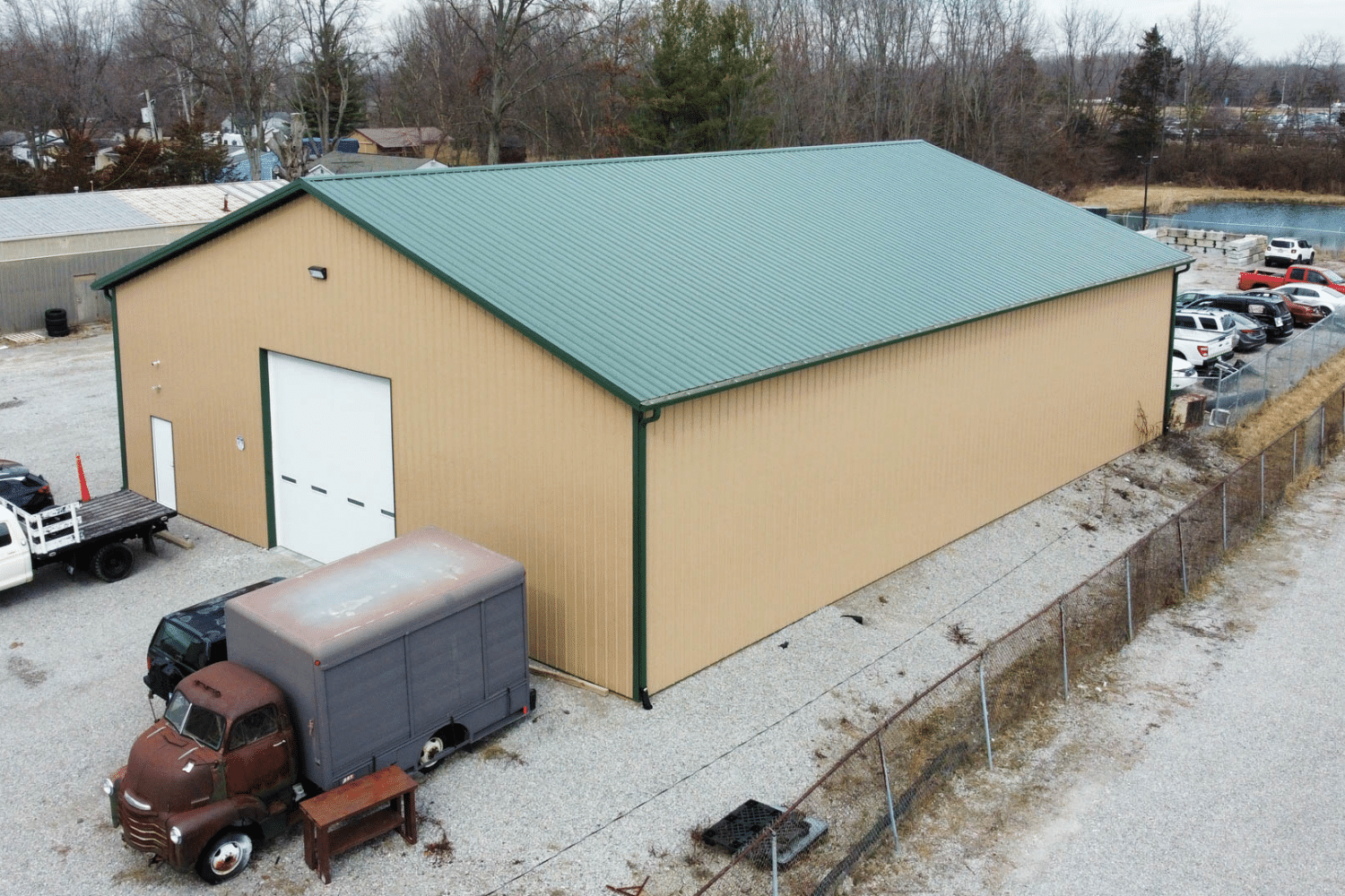 beige and green 60x90 commercial pole barn kit with garage