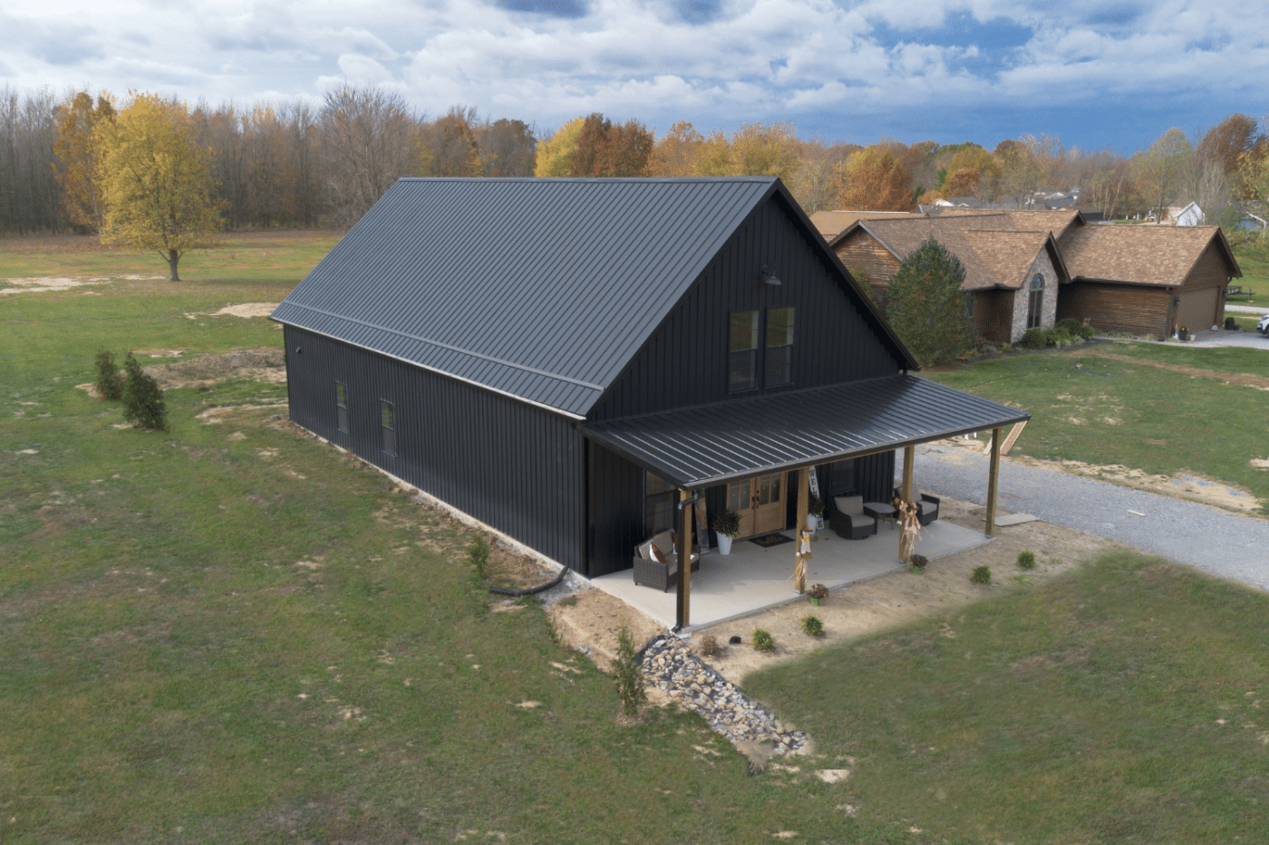 black 100x100 barndominium with porch