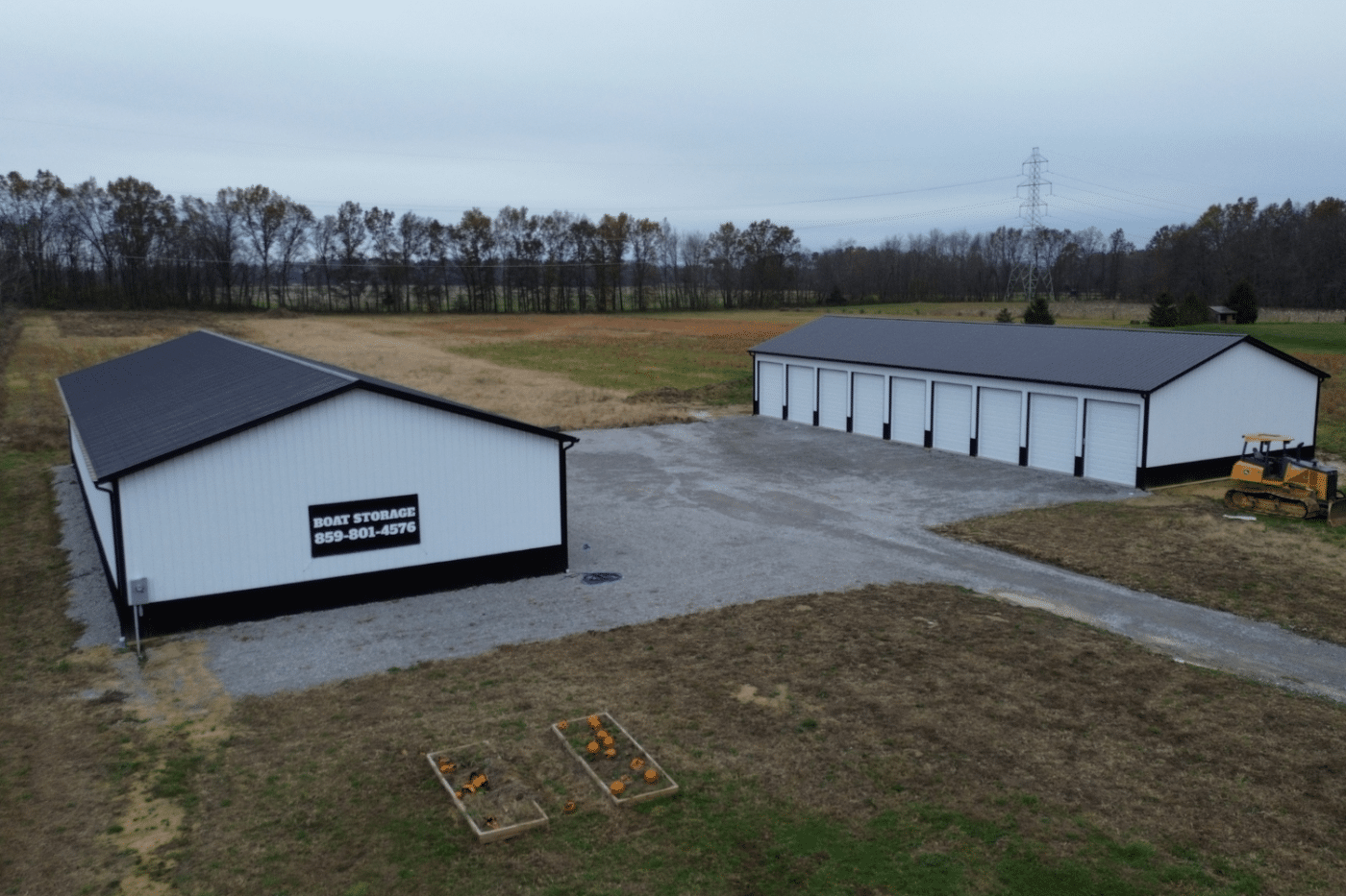 black and white two 60x70 garage pole barn kits with many garages