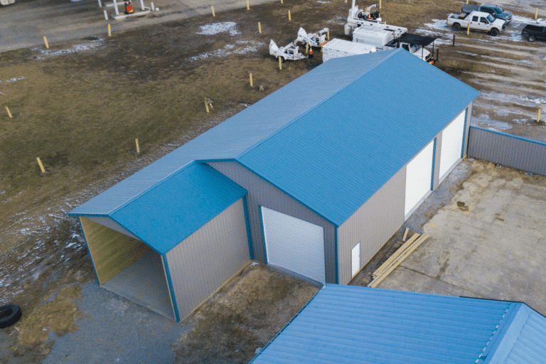 grey 30x80 commercial pole barn kit with blue roof and garages