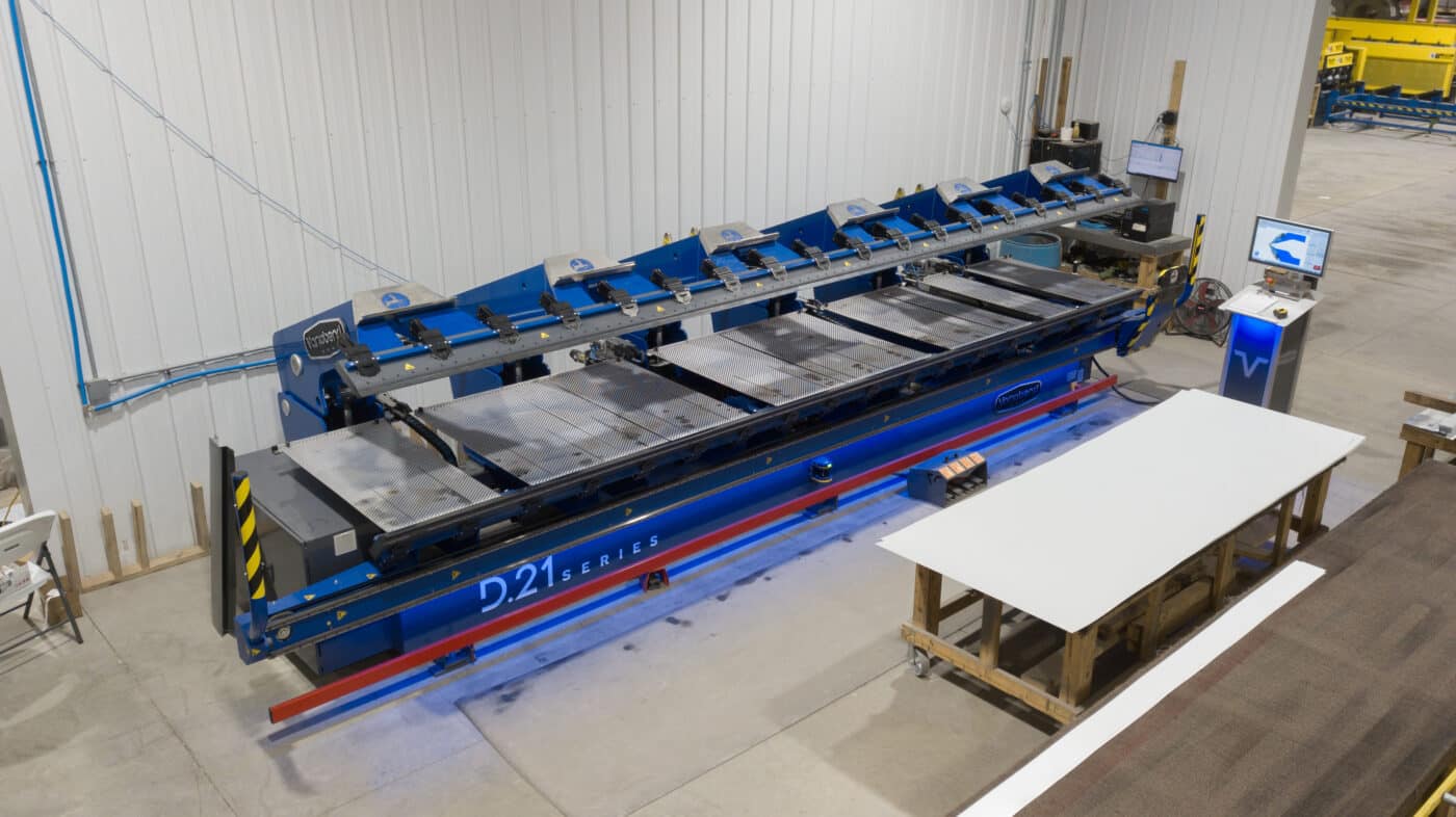 blue machine used to manufacture metal panels for pole barn kits in Independence KY