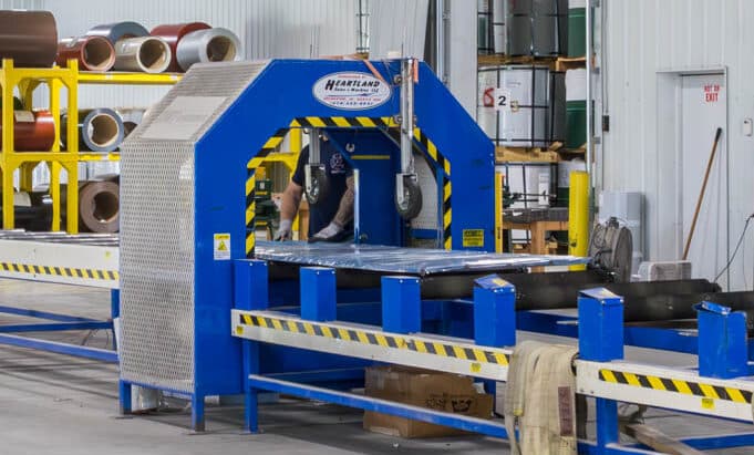 blue metal panels being manufactured