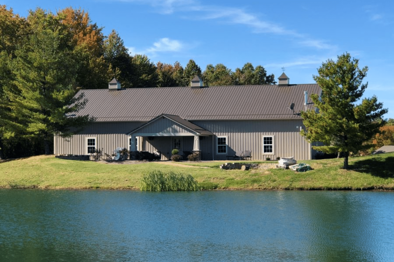 brown 100x100 barndominium near water