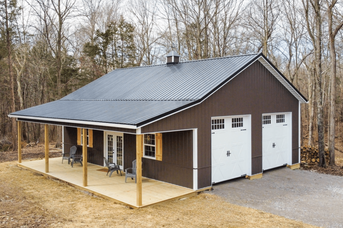 brown 100x100 barndominium with two white garages