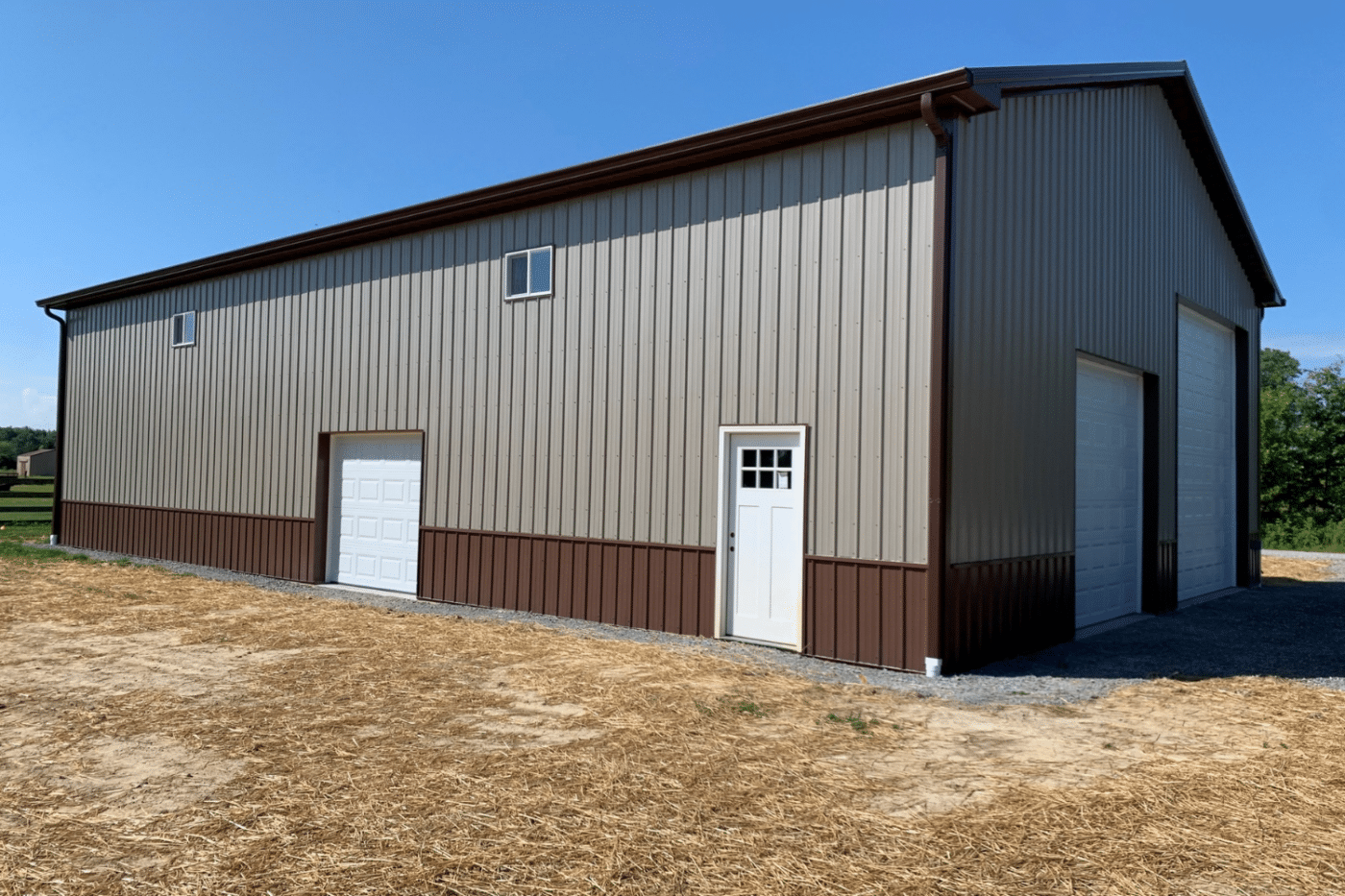 brown 60x90 commercial pole barn kit with two garages