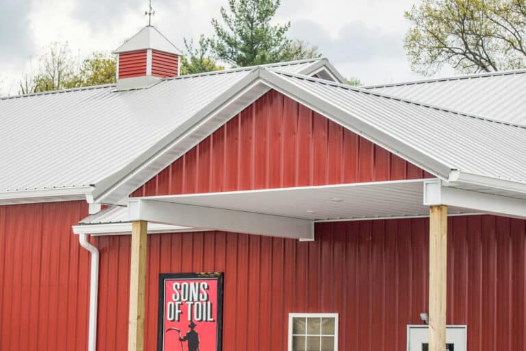 close up view of red metal and light gray metal on commercial pole barn in Sardinia OH