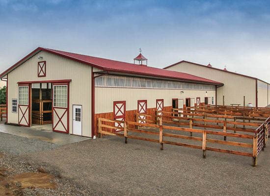 cream and red sided agricultural pole barn