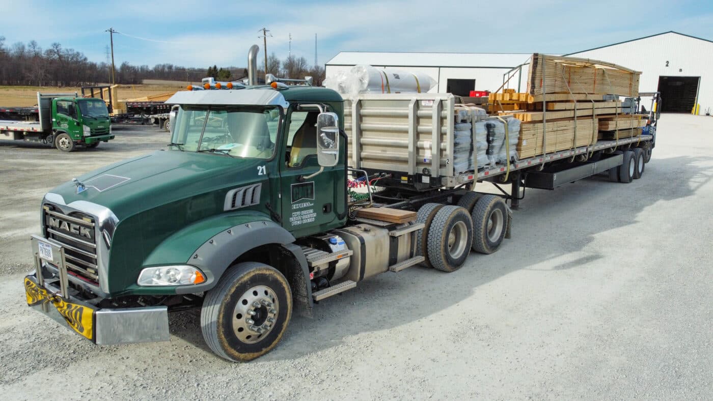 delivery truck delivering 50x100 pole barn garage kits 1