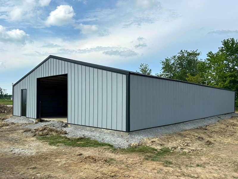 front view of gray and black trimmed 40x60 pole barn garage with black metal roofing