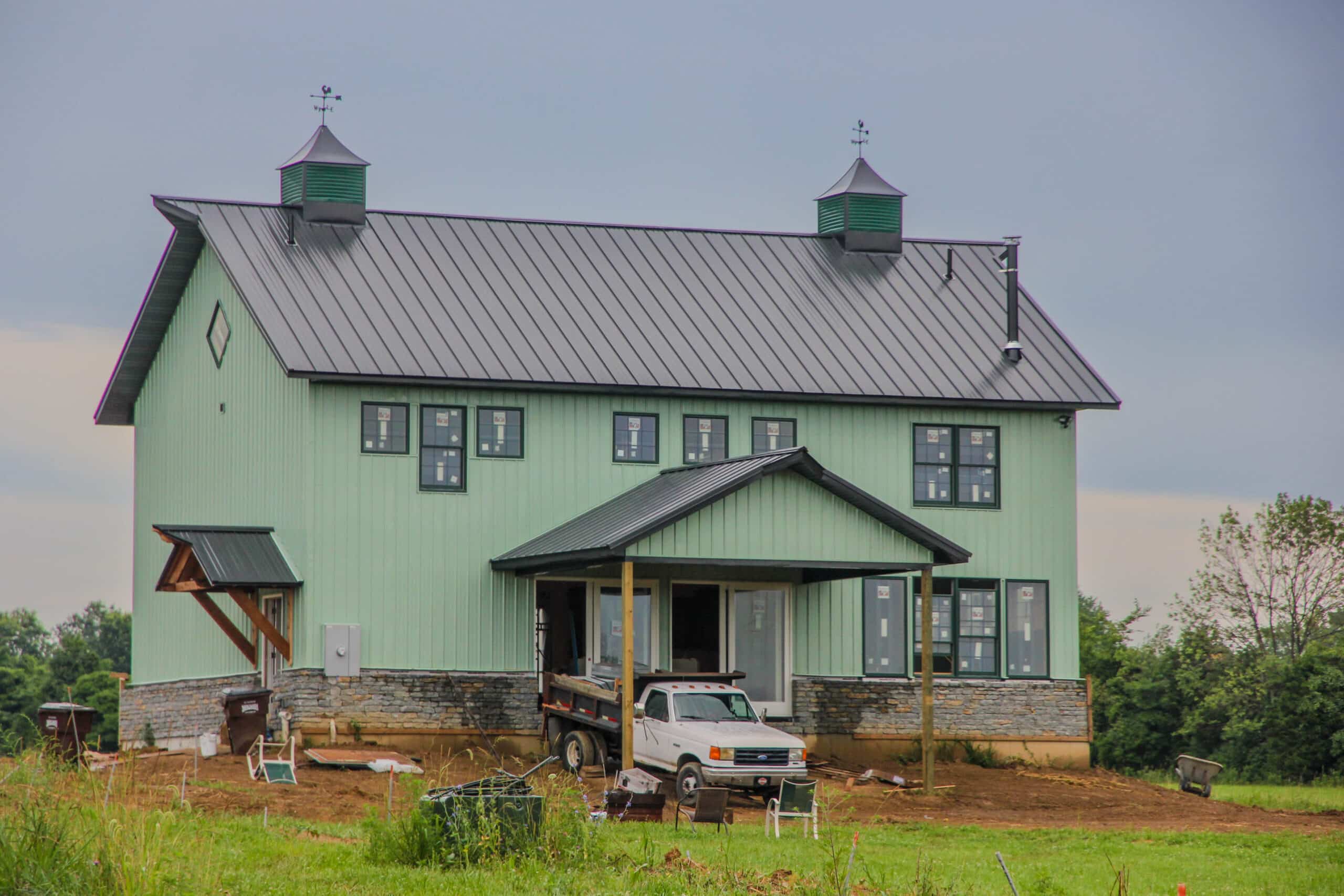 green 20x40 barndominium with windows