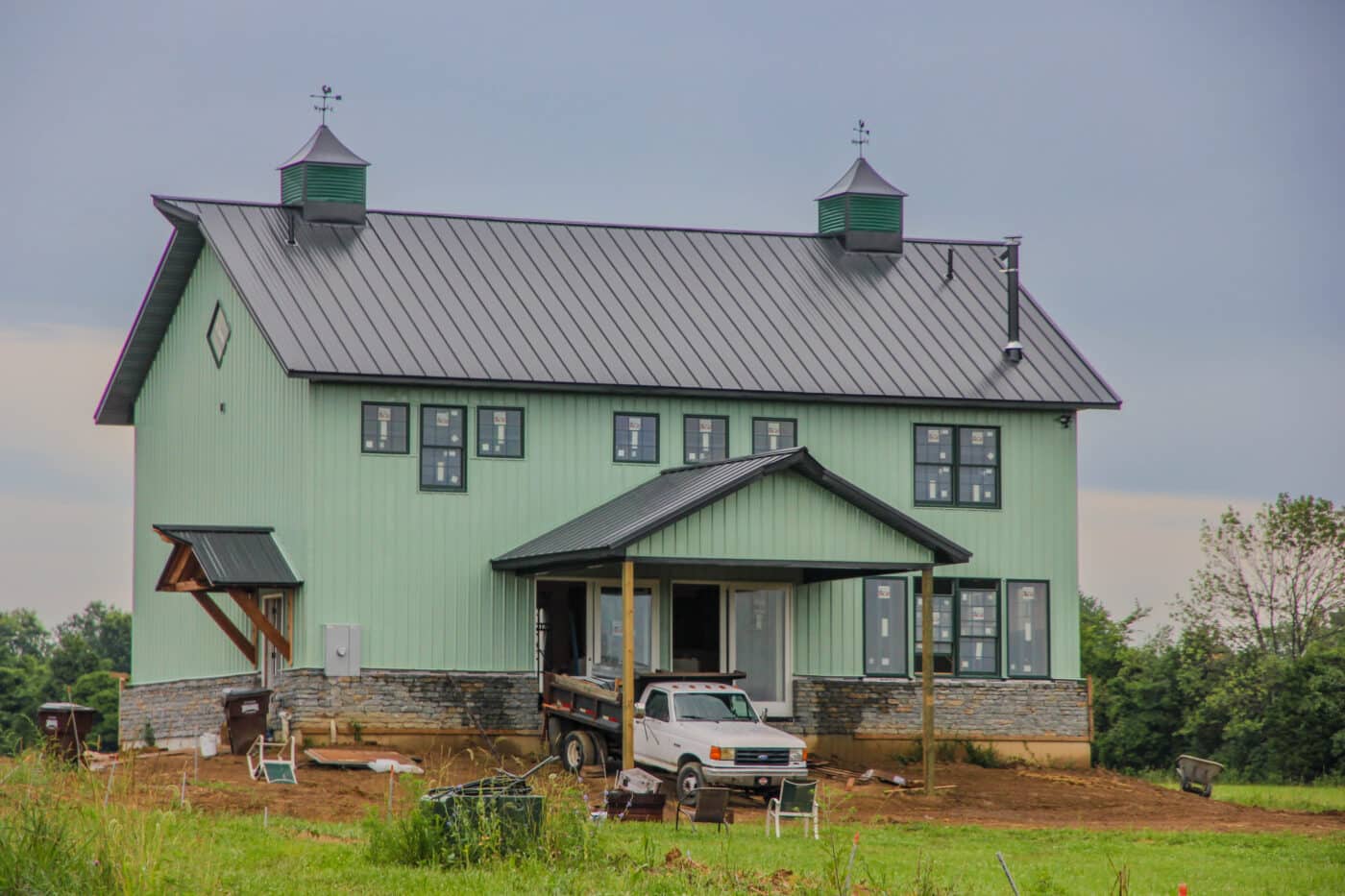 A green 80x120 barndominium