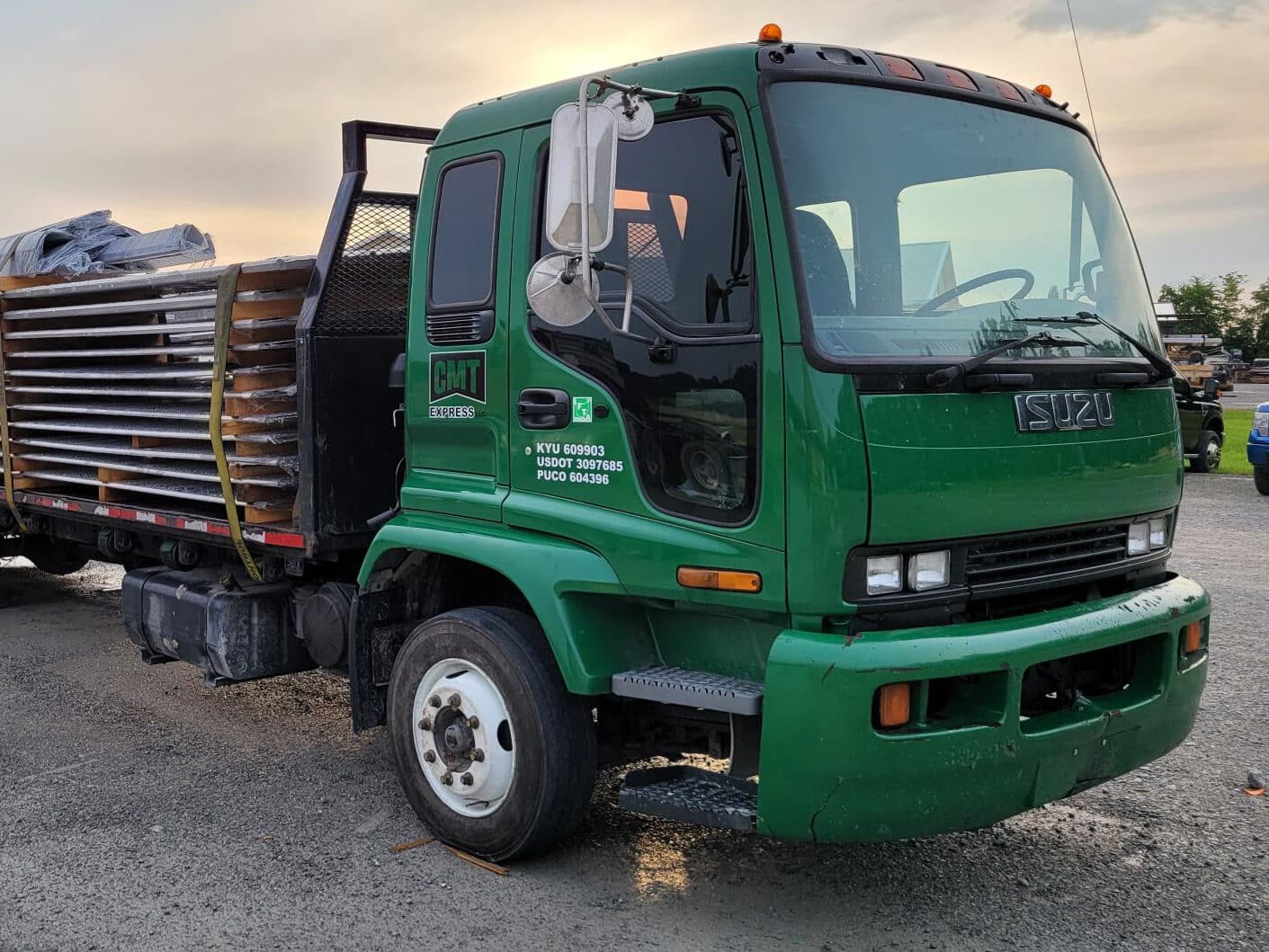 green CMT Component truck with metal panels on the back