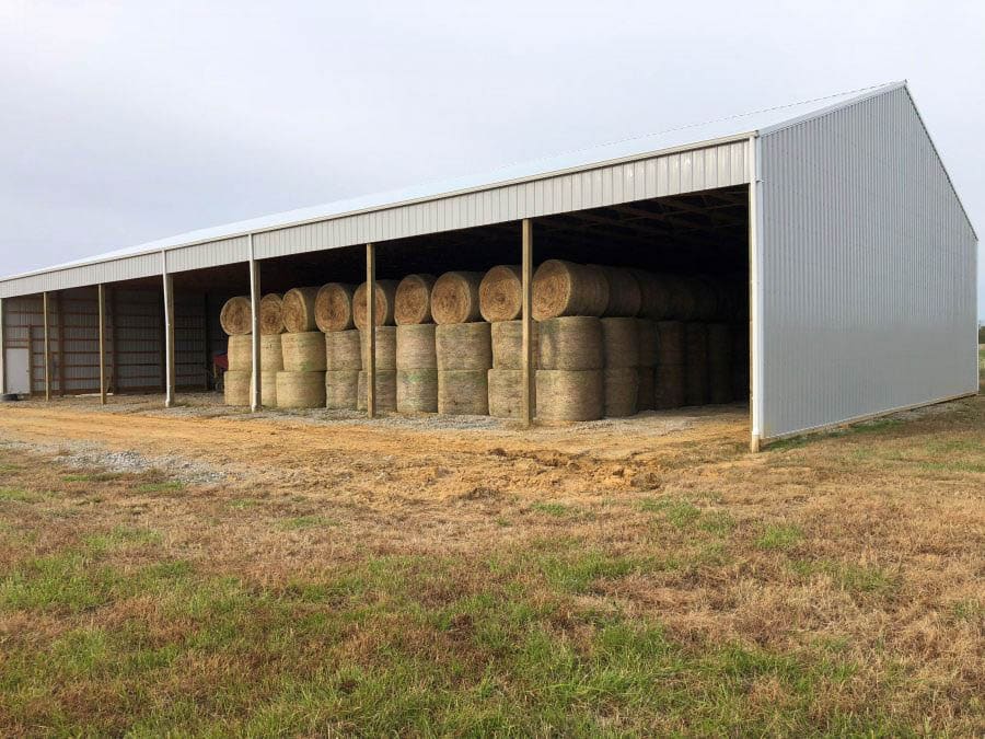 hay being stored in agricultural pole barn