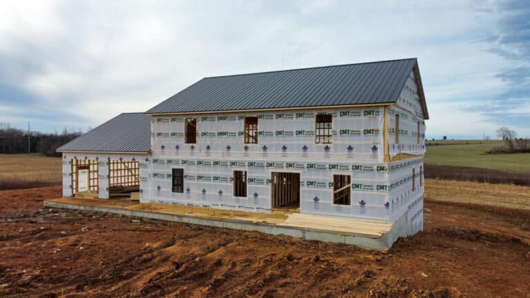 house in west union oh with black metal panels wrapped in tyvek