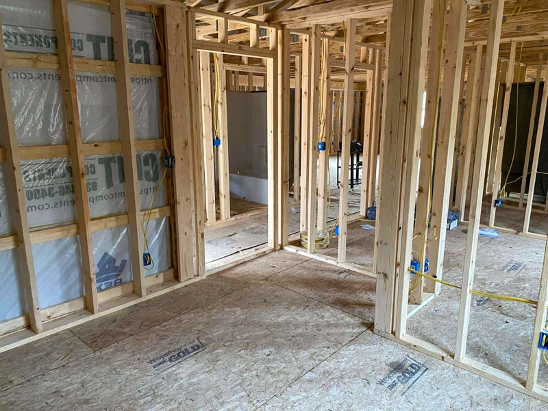interior of barndominium still under construction with multiple rooms built out