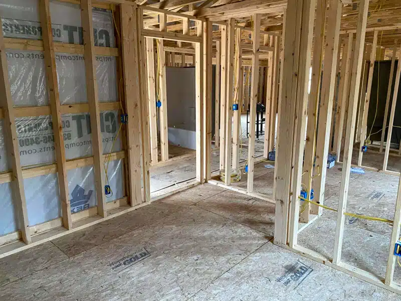 interior of barndominium still under construction with multiple rooms built out