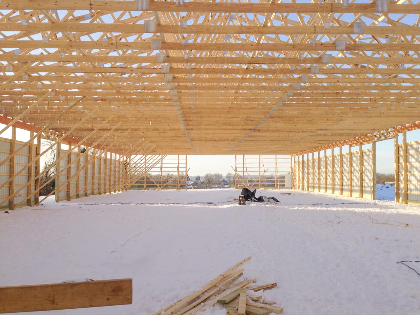 interior of pole barn with clear view of roof trusses