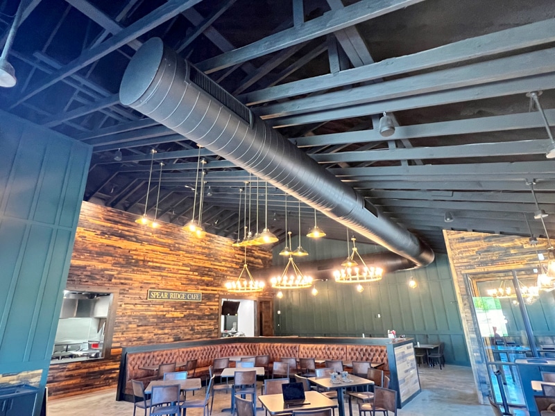 interior of the spear ridge general store featuring black painted roof trusses