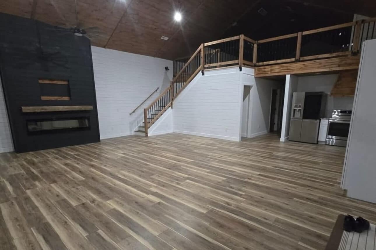 loft and fireplace inside 20x50 barndominium