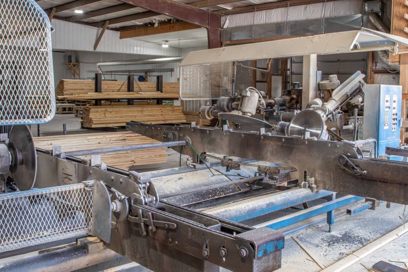 machine with multiple sanders used to refine lumber for wooden roof trusses