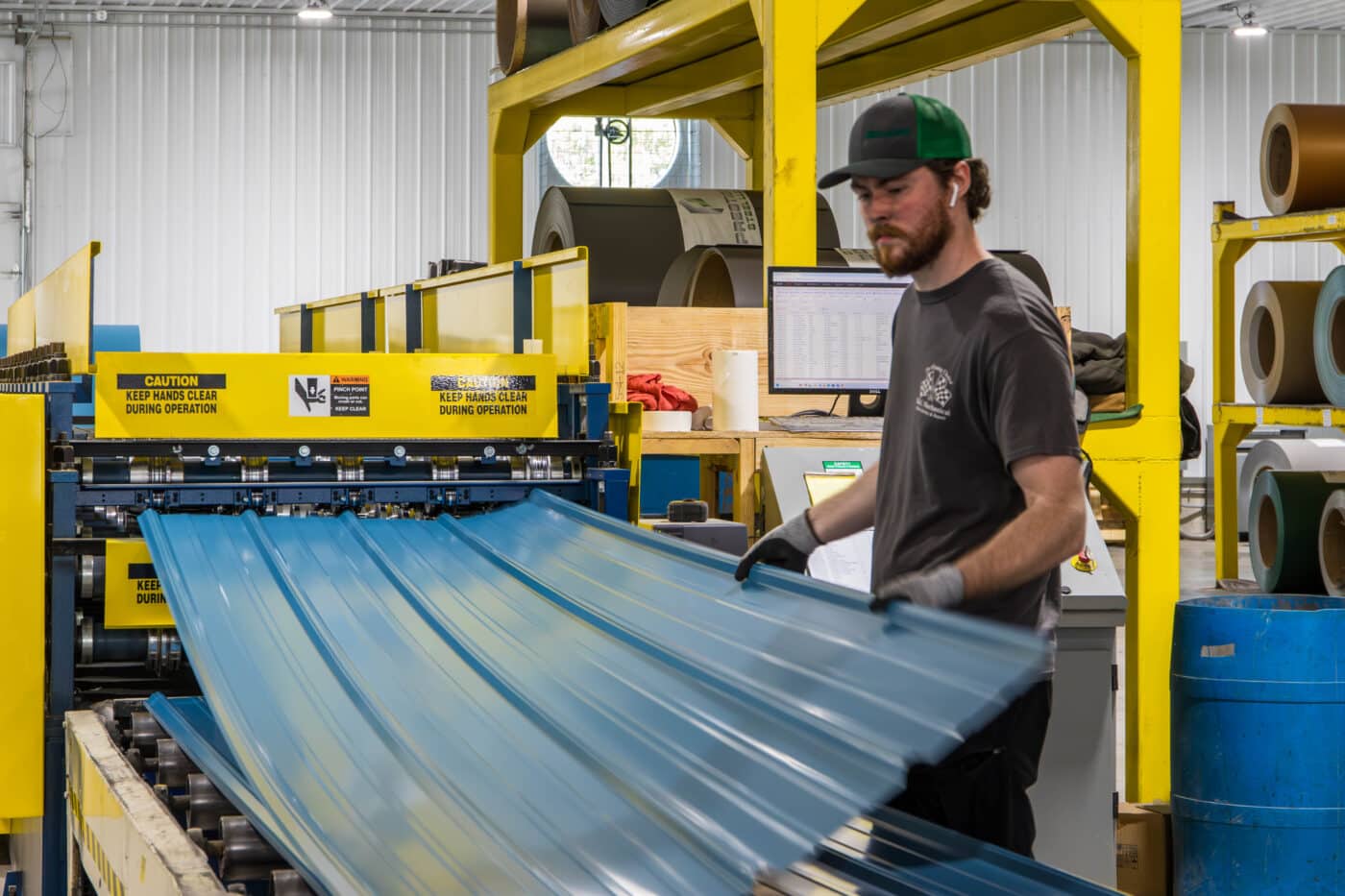 Man manufacturing metal panels for pole barns in Cattletsburg KY