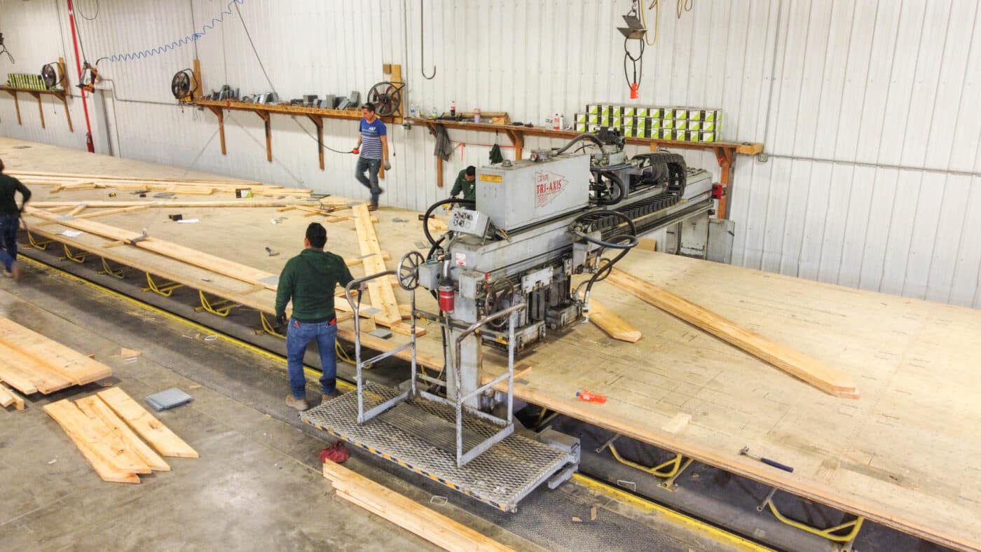 man manufacturing wooden roof trusses