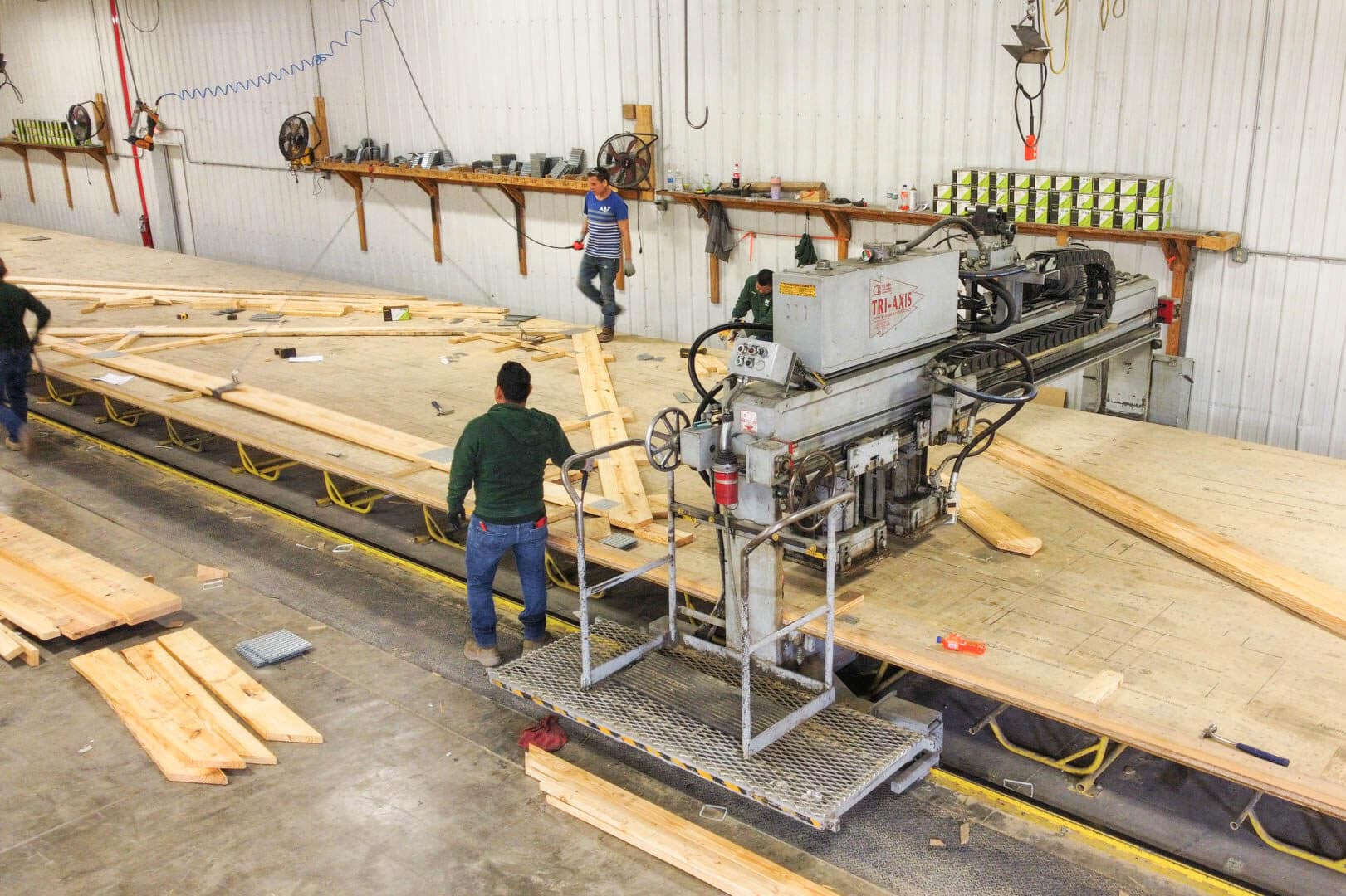 men manufacturing wooden roof trusses