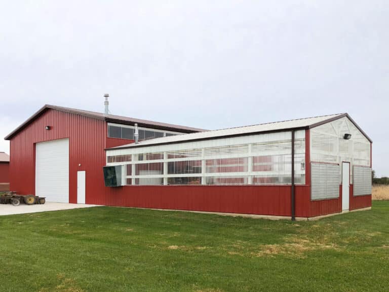 red and clear sided 42x56 equestrian pole barn