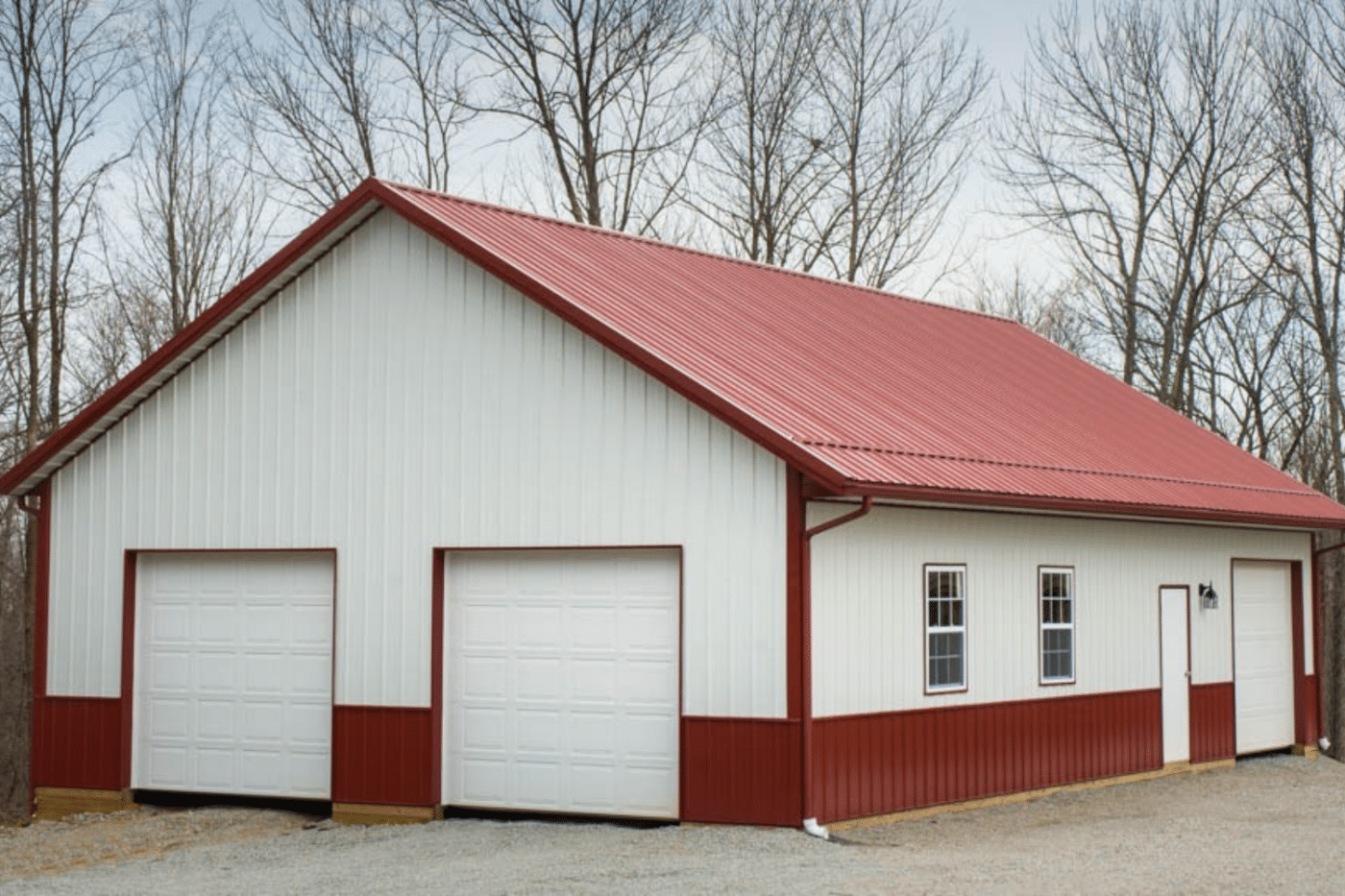 red and white 50x60 garage pole barn kit with two white garages