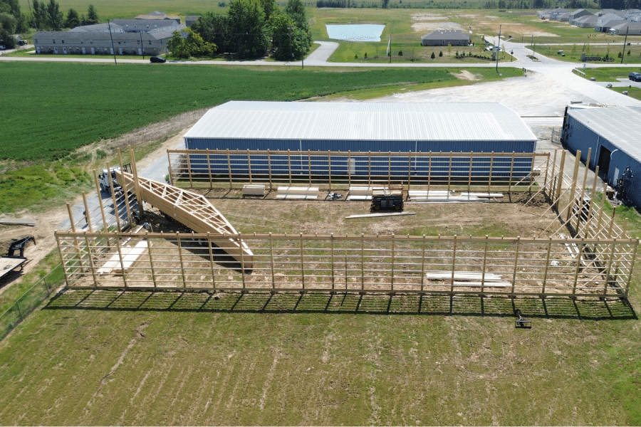 roof trusses being delivered to pole barn job site