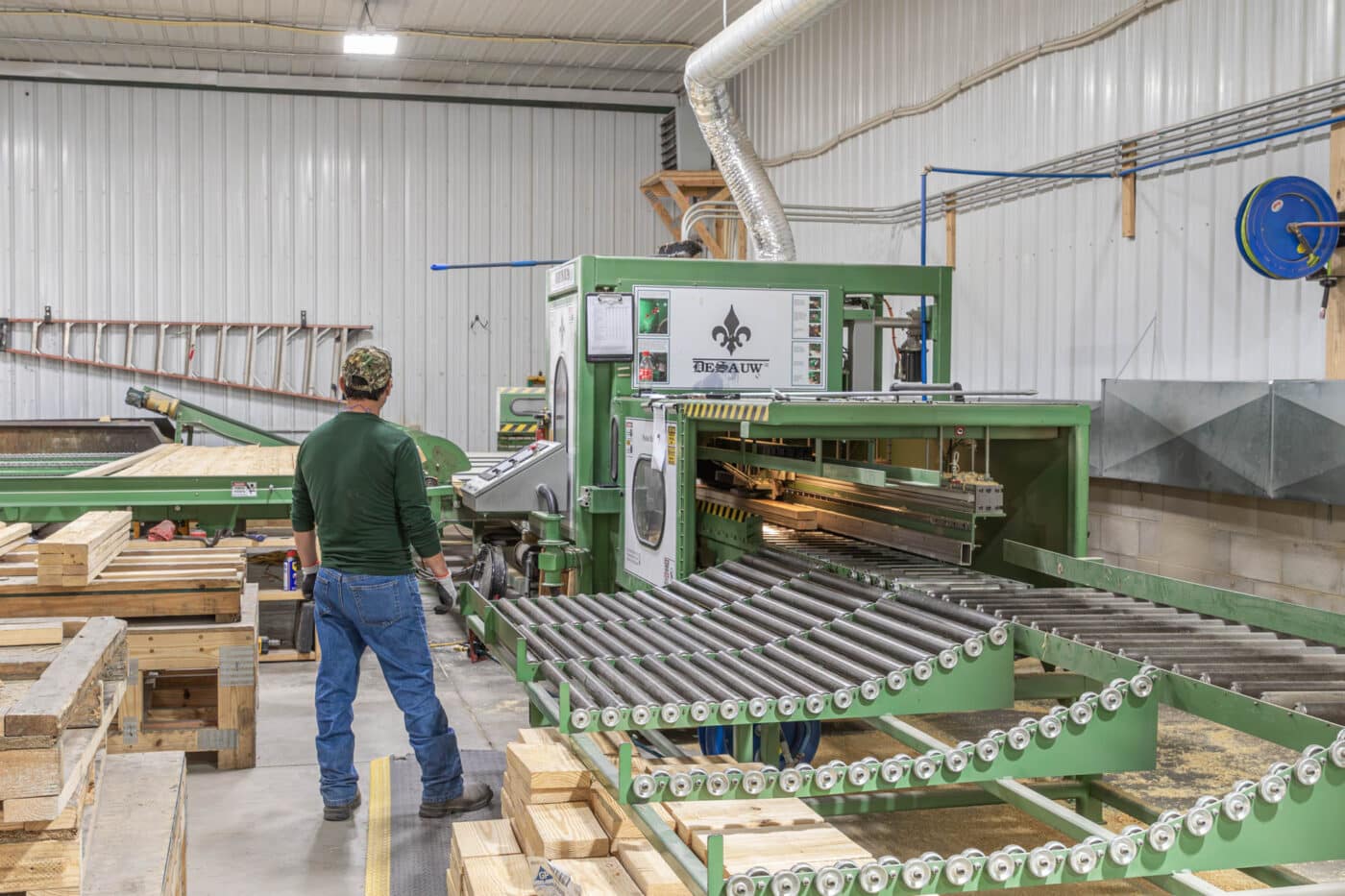 roof trusses being put together and assembled by green machine