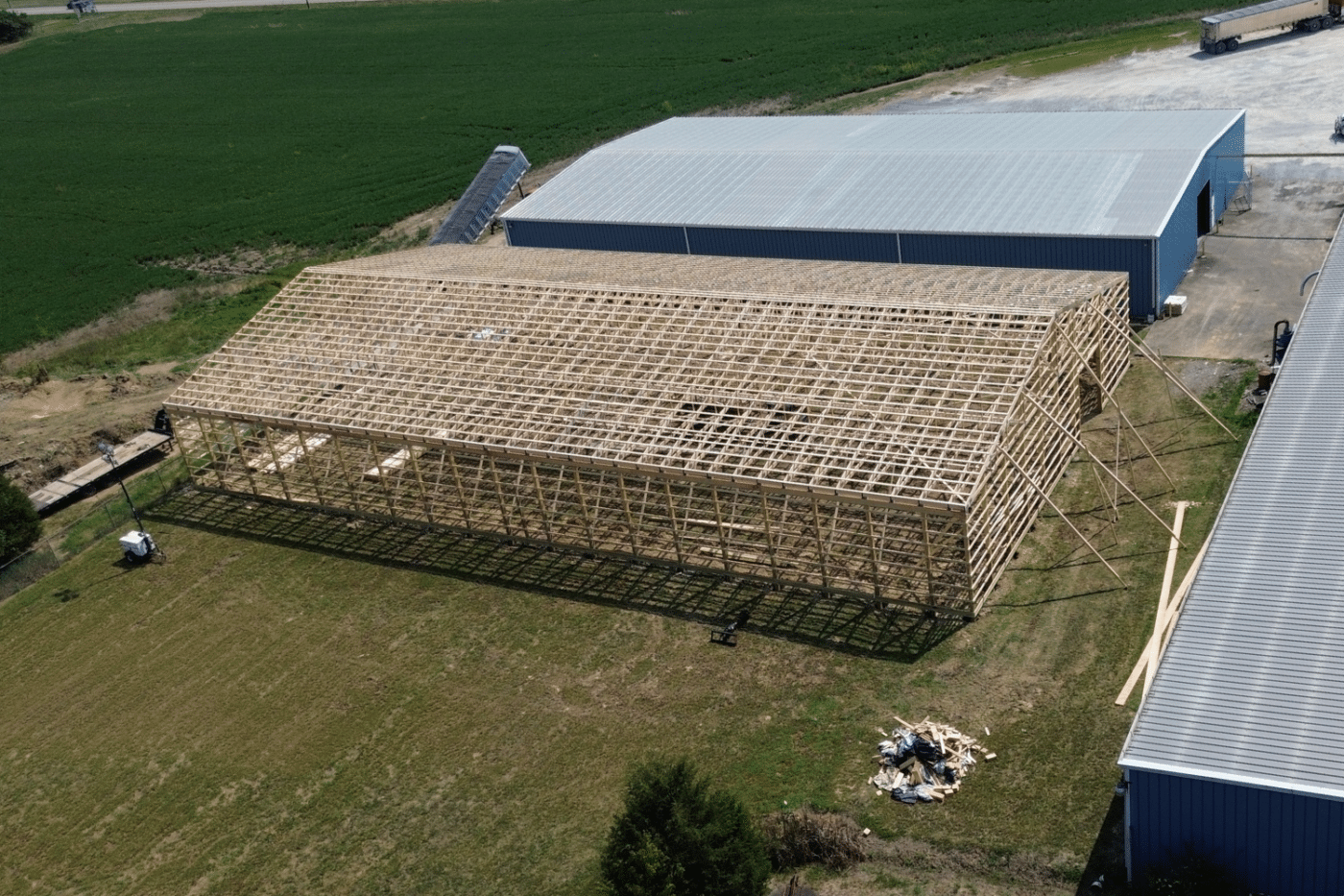 roof trusses being constructed for 60x100 agricultural pole barn kit