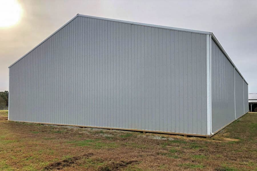 side of gray 60x60 agricultural pole barn