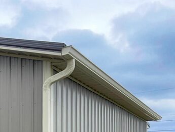 side of gray metal 24x28 garage pole barn built by dutch builders