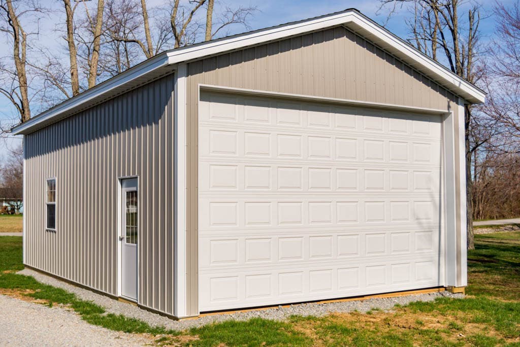 tan and white garage door on 32x40 pole barn garage