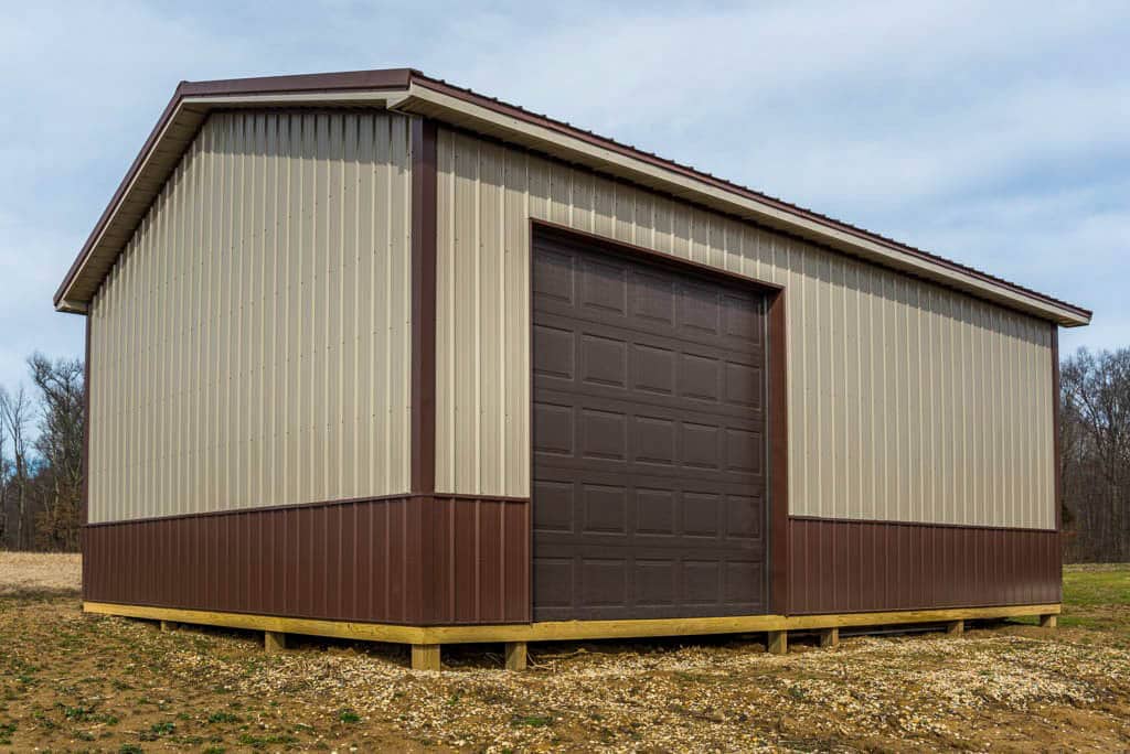 tan and brown trimmed 32x40 pole barn garage with one brown garage door