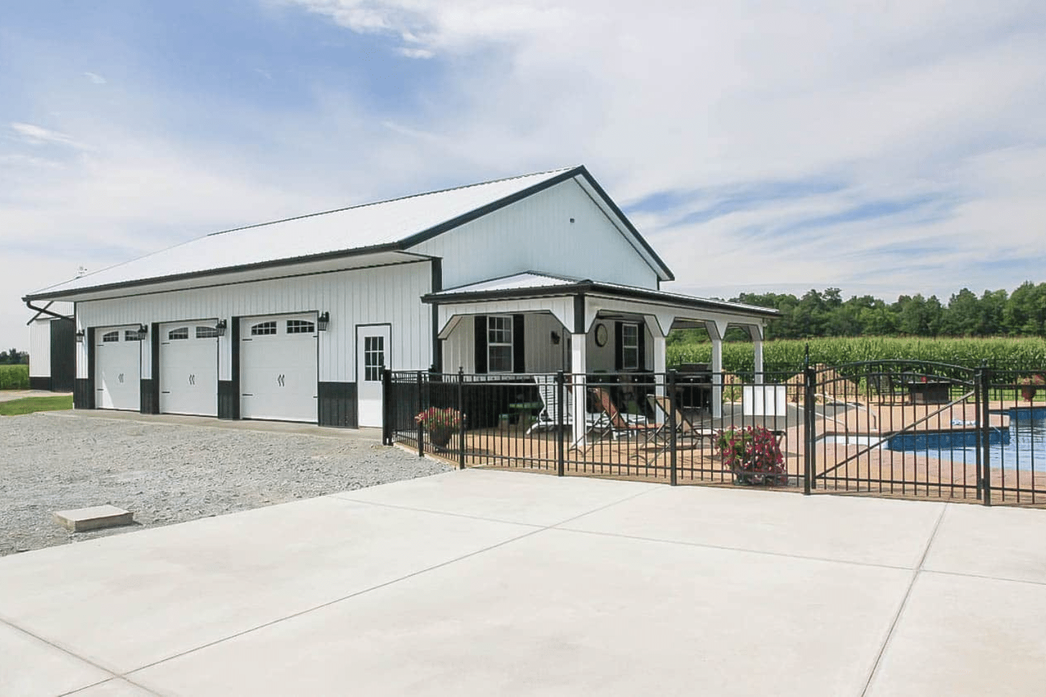 white 100x100 barndominium near pool